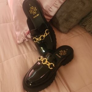 Sam & Libby Glossy Black Mules with Gold Chain Detail
